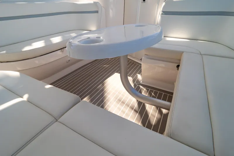 Slide: The Image of Luxurious seating area on a 2016 Intrepid 400 Cuddy boat with sleek white cushions. - 43
