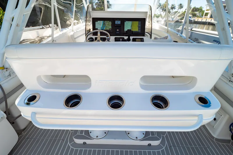 Slide: The Image of 2016 Intrepid 400 Cuddy helm with modern controls and cup holders. - 50