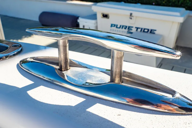 Slide: The Image of Shiny cleat on 2016 Intrepid 400 Cuddy boat, with Pure Tide cooler in background. - 54