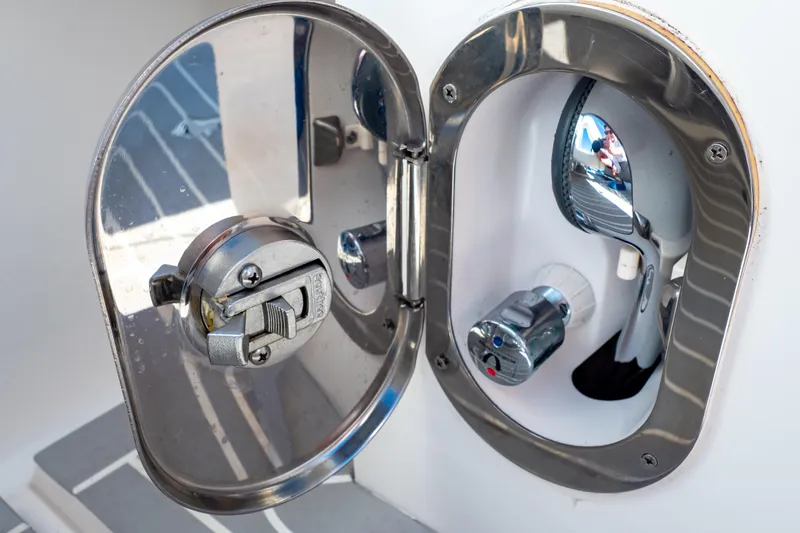 Slide: The Image of Stainless steel hatch on 2016 Intrepid 400 Cuddy boat, showcasing marine hardware. - 56
