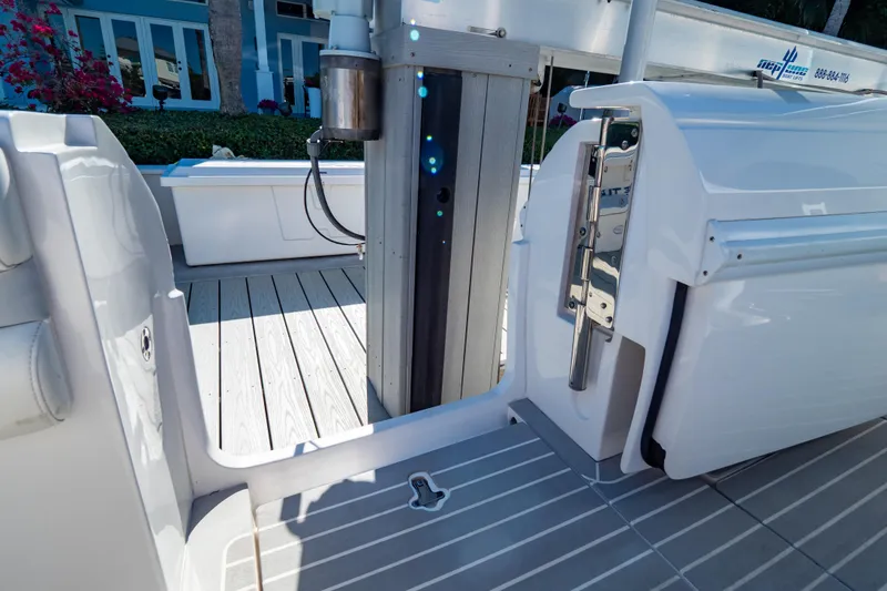 Slide: The Image of 2016 Intrepid 400 Cuddy boat deck with open door and sleek design. - 58