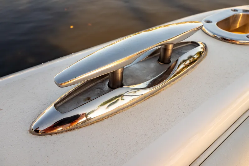 Slide: The Image of Close-up of a polished cleat on a 2016 Intrepid 400 Cuddy boat. - 65