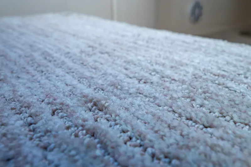 Slide: The Image of Close-up of textured carpet inside a 2016 Intrepid 400 Cuddy boat. - 66