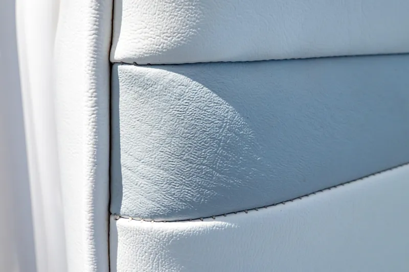 Slide: The Image of Close-up of white leather upholstery on a 2016 Intrepid 400 Cuddy boat. - 67