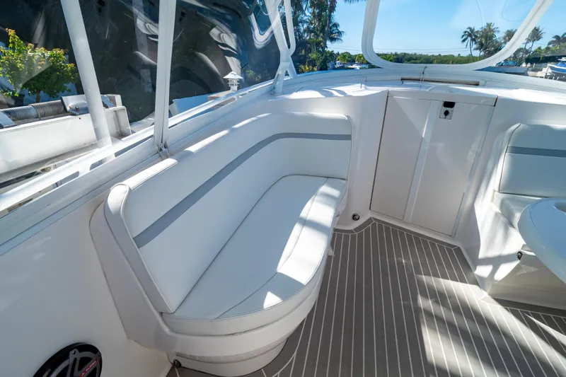 Slide: The Image of 2016 Intrepid 400 Cuddy boat interior with white seating and sleek design. - 68