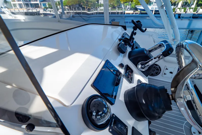 Slide: The Image of Helm of 2016 Intrepid 400 Cuddy with navigation instruments and controls. - 70