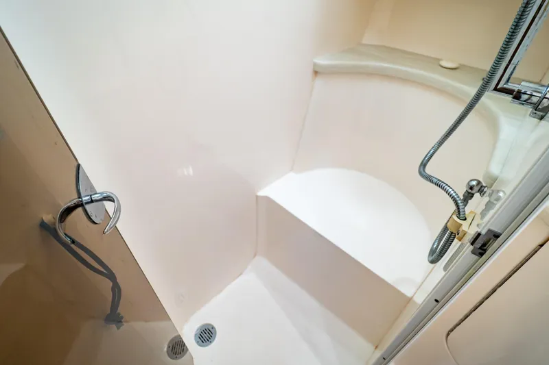 Slide: The Image of Shower area in 2016 Intrepid 400 Cuddy boat, featuring sleek design and modern fixtures. - 71