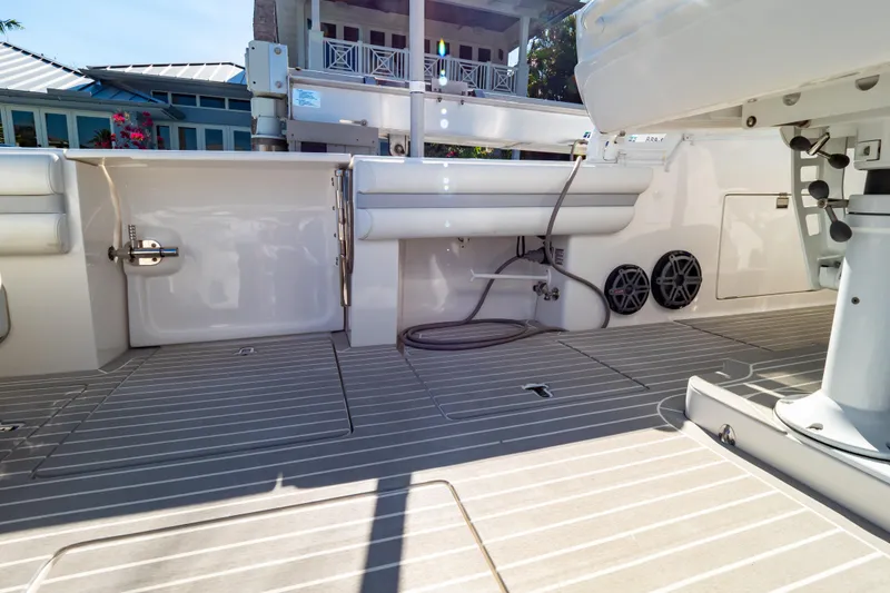 Slide: The Image of 2016 Intrepid 400 Cuddy boat deck with seating and storage compartments. - 72