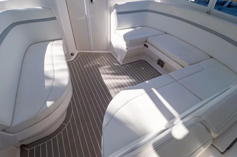 Slide: The Image of Luxurious seating area on a 2016 Intrepid 400 Cuddy boat with sleek white upholstery. - 73