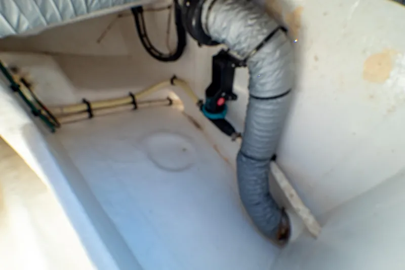 Slide: The Image of 2016 Intrepid 400 Cuddy boat interior showing ventilation and piping system. - 84