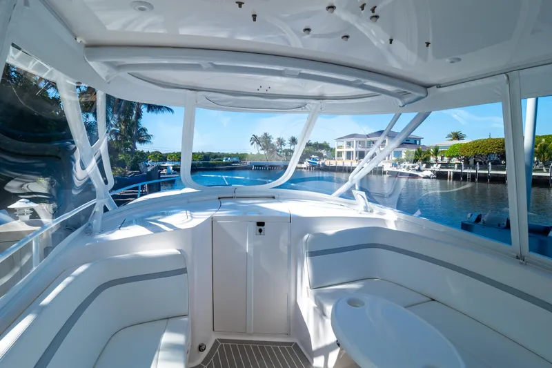 Slide: The Image of Interior view of 2016 Intrepid 400 Cuddy boat with waterfront background. - 91