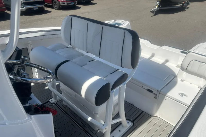 Slide: The Image of 2024 Yamaha Boats 252 FSH Sport interior with sleek seating and steering wheel. - 10