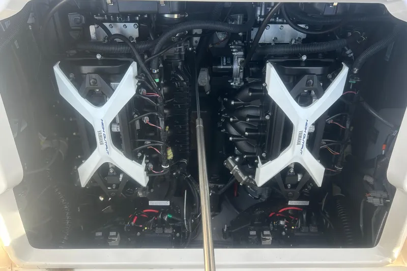 Slide: The Image of Engine compartment of 2024 Yamaha Boats 252 FSH Sport, showcasing dual high-output engines. - 15