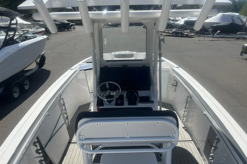 Slide: The Image of 2024 Yamaha Boats 252 FSH Sport center console, featuring sleek design and advanced controls. - 7