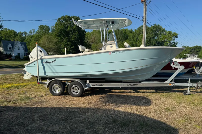 The Image of 2025 Bulls Bay 230 Center Console boat on trailer, parked outdoors. - 0