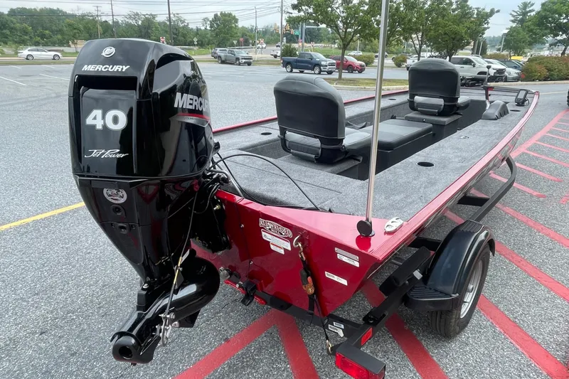 Slide: The Image of 2026 Tracker Panfish 17 boat with Mercury 40 Jet motor in parking lot. - 2