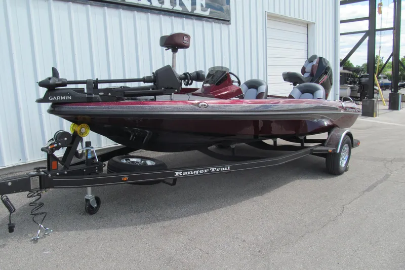 Slide: The Image of 2026 Ranger Z185 boat on trailer, featuring Garmin equipment, parked outside a building. - 1