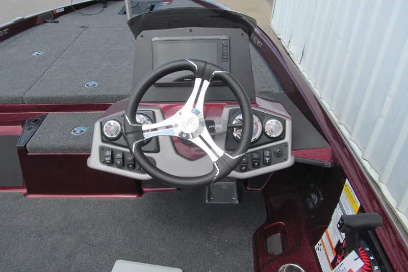 Slide: The Image of 2026 Ranger Z185 boat dashboard with steering wheel and control panel. - 5