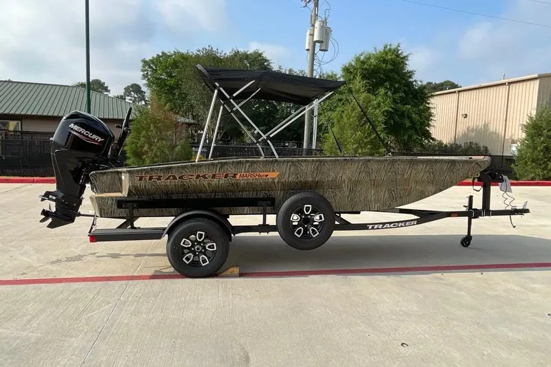The Image of 2026 Tracker Grizzly 1756 T Marsh boat on trailer, parked outdoors. - 0
