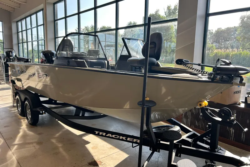 The Image of 2026 Tracker Targa V-19 WT boat displayed indoors with trailer. - 0