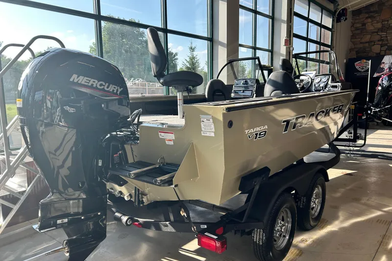 Slide: The Image of 2026 Tracker Targa V-19 WT boat with Mercury engine in showroom. - 6
