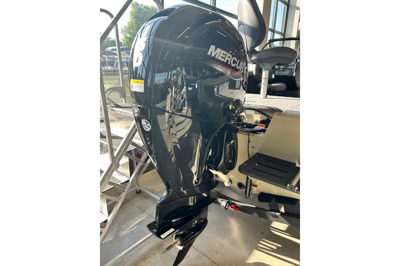 Slide: The Image of 2026 Tracker Targa V-19 WT boat with Mercury outboard motor in showroom. - 8