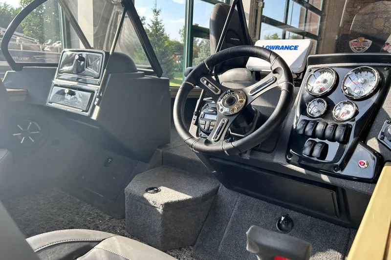 Slide: The Image of 2026 Tracker Targa V-19 WT boat interior with steering wheel and control panel. - 4