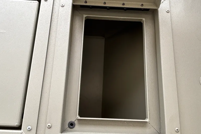 Slide: The Image of Open compartment on 2026 Tracker Grizzly 2072 CC boat, showcasing storage space. - 32