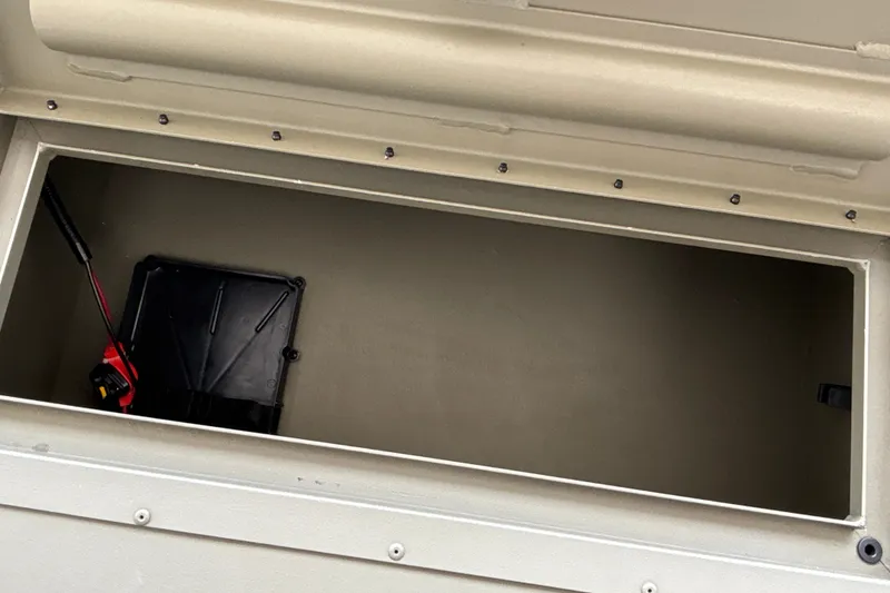 Slide: The Image of Open storage compartment in 2026 Tracker Grizzly 2072 CC boat. - 34