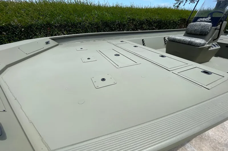 Slide: The Image of 2026 Tracker Grizzly 2072 CC boat deck with storage compartments and seating. - 48