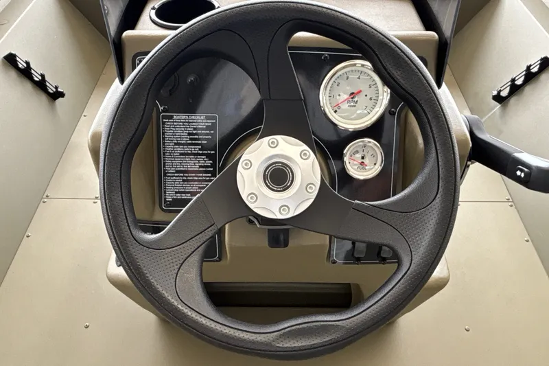 Slide: The Image of Steering wheel and gauges of 2026 Tracker Grizzly 2072 CC boat. - 21