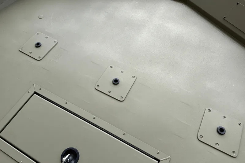 Slide: The Image of Close-up of 2026 Tracker Grizzly 2072 CC boat deck with hatch and mounting plates. - 29