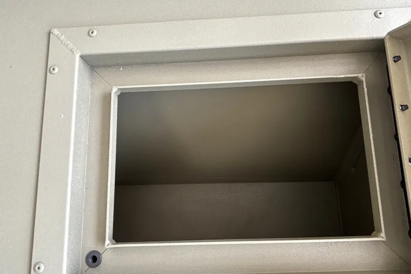 Slide: The Image of Open storage compartment on 2026 Tracker Grizzly 2072 CC boat, showcasing interior space. - 35