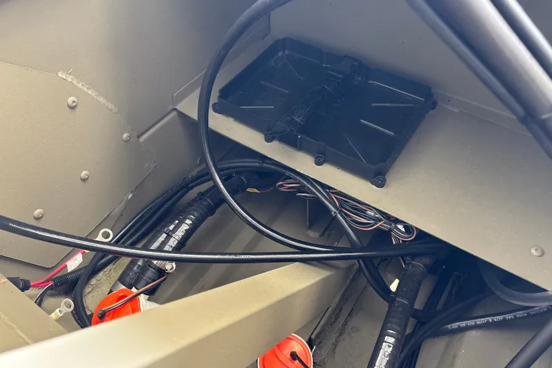 Slide: The Image of Interior wiring and components of a 2026 Tracker Grizzly 2072 CC boat. - 37