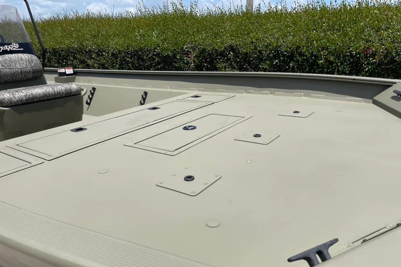 Slide: The Image of 2026 Tracker Grizzly 2072 CC boat deck with storage compartments and seating. - 49