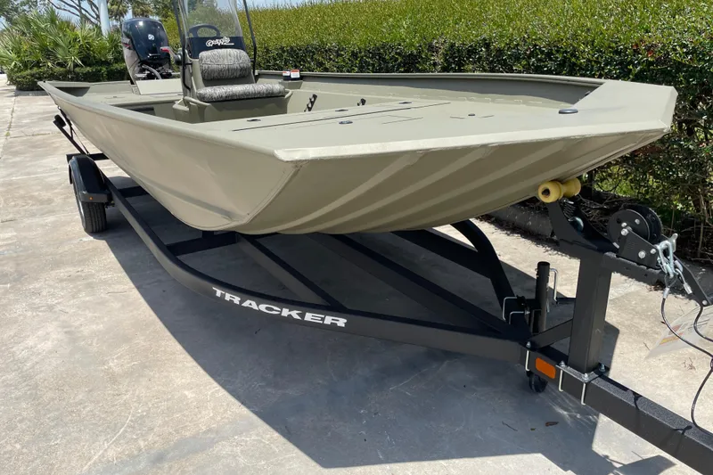 Slide: The Image of 2026 Tracker Grizzly 2072 CC boat on trailer, parked outdoors. - 40