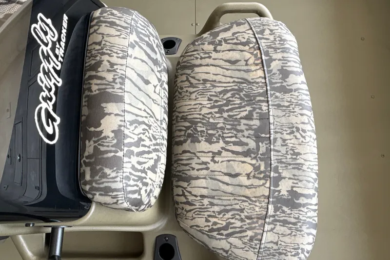 Slide: The Image of 2026 Tracker Grizzly 2072 CC boat seats with camouflage pattern. - 26