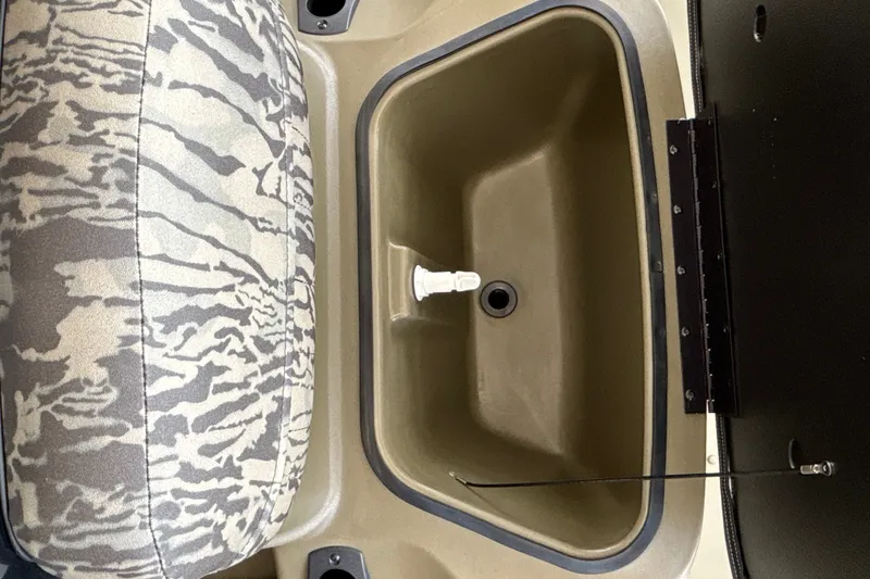 Slide: The Image of Interior view of 2026 Tracker Grizzly 2072 CC boat seat and storage compartment. - 27