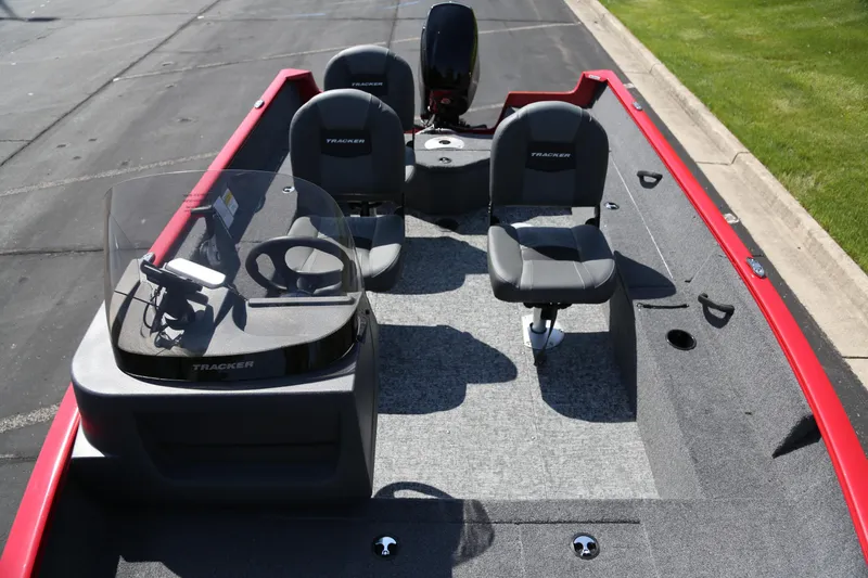 Slide: The Image of 2026 Tracker Pro Guide V-16 SC boat interior with seating and steering console. - 4