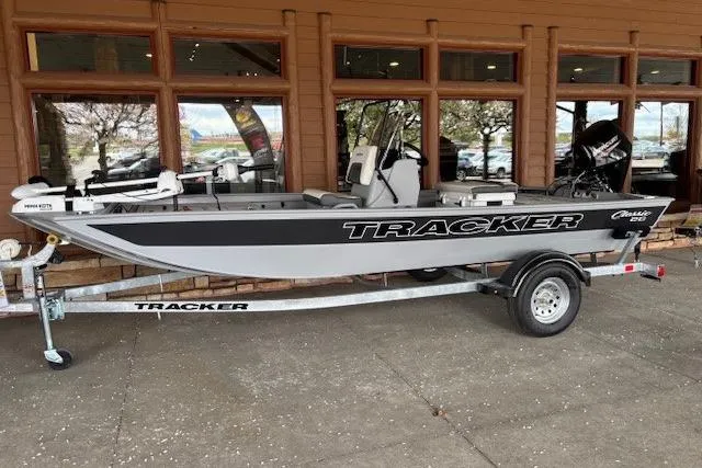 The Image of 2026 Tracker Bass Tracker Classic CC boat on trailer, parked outside a building. - 0