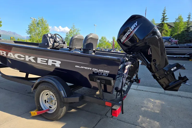 Slide: The Image of 2026 Tracker Super Guide V-16 SC boat with Mercury outboard motor on trailer. - 3