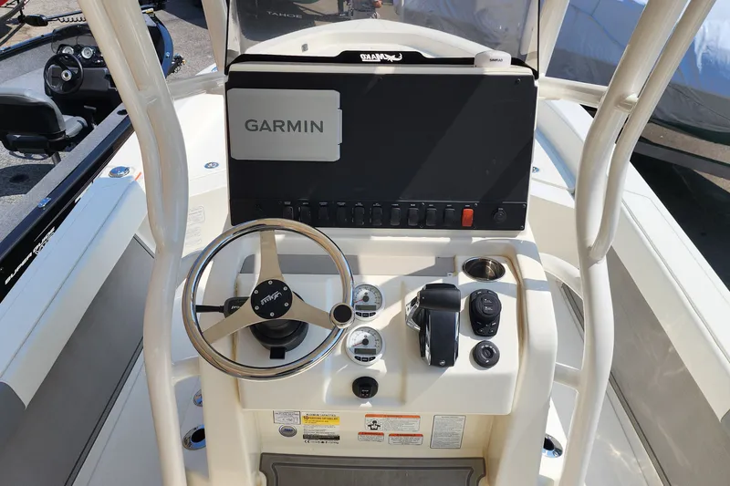 Slide: The Image of Steering console of 2026 Mako 24 APEX boat with Garmin navigation system. - 1