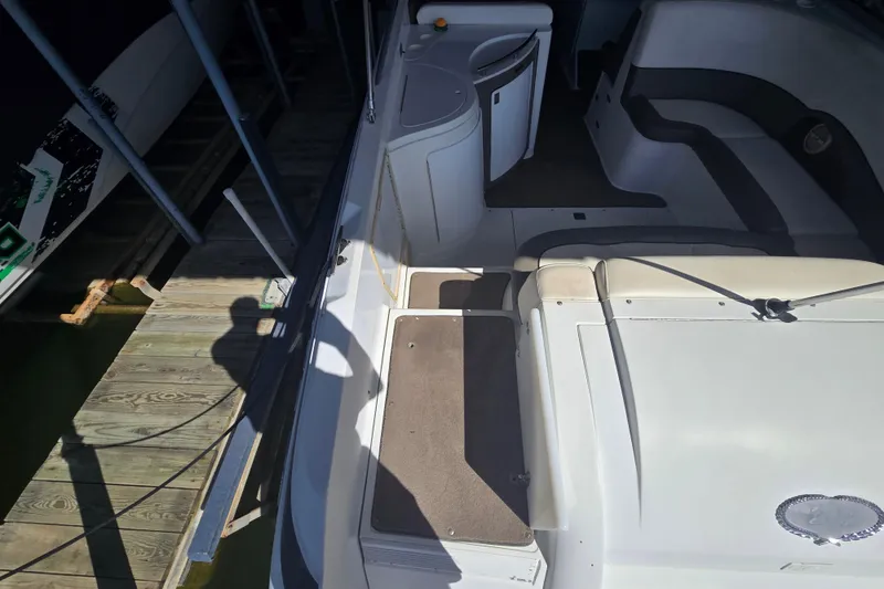 Slide: The Image of 2001 Cobalt 292 boat interior with seating and dock shadow. - 10