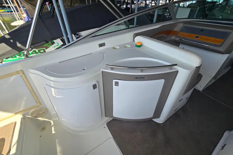 Slide: The Image of Interior of a 2001 Cobalt 292 boat featuring a sleek kitchenette area. - 11