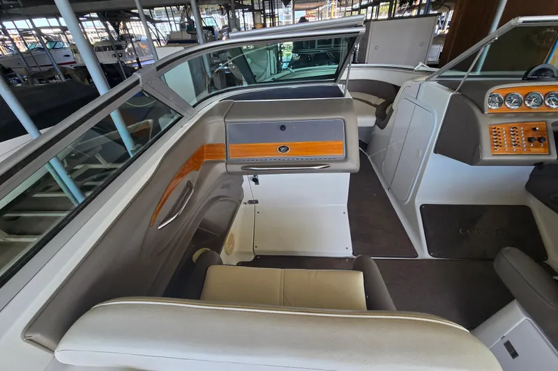 Slide: The Image of Interior of a 2001 Cobalt 292 boat, featuring seating and dashboard controls. - 16