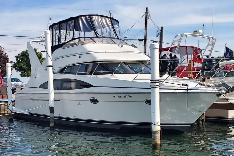 The Image of 2004 Carver 420 Mariner yacht docked at harbor. - 0
