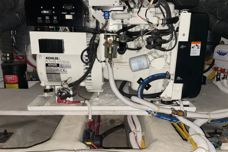 Slide: The Image of Engine room of 2004 Carver 420 Mariner featuring Kohler power system. - 17