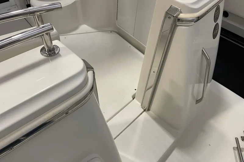 Slide: The Image of 2004 Carver 420 Mariner boat interior with stainless steel railings and white surfaces. - 20