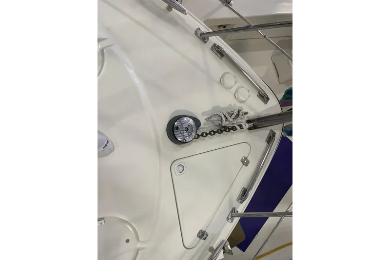 Slide: The Image of 2004 Carver 420 Mariner deck with anchor chain and railing details. - 25