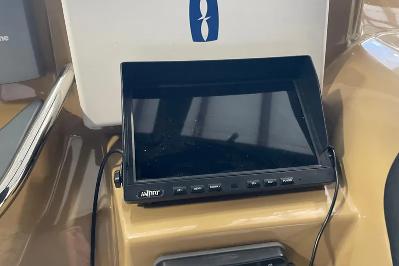 Slide: The Image of Dashboard of a 2004 Carver 420 Mariner with an Amtifo display screen. - 27